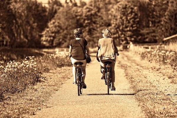 2 people riding bikes